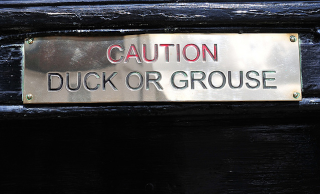 Duck or Grouse sign on the door of The Hinds Head Bray