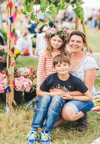 Festival family with flowers garlands