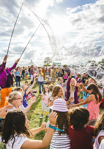 Children playing giant bubbles