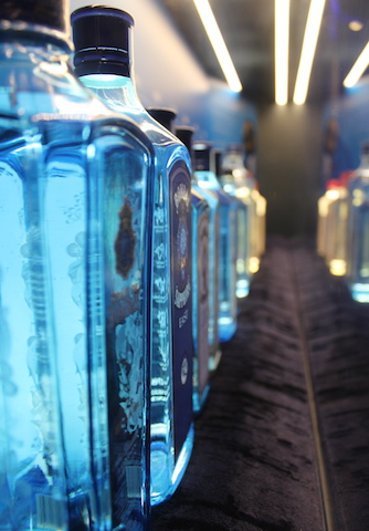 Row of blue Bombay Sapphire gin bottles