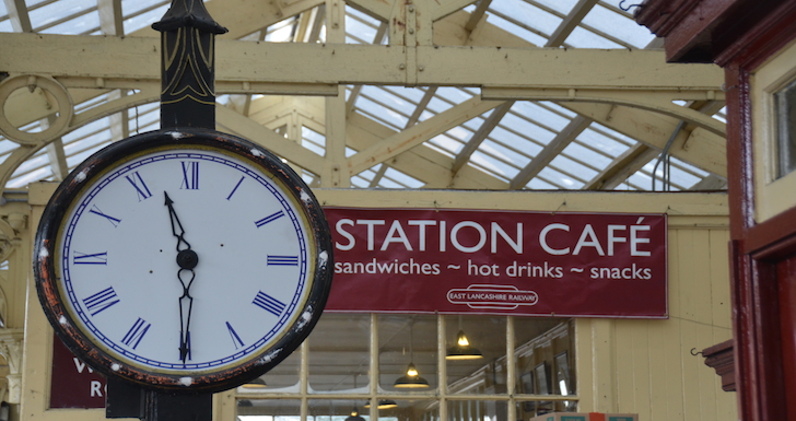 old railway clock and station cafe sign
