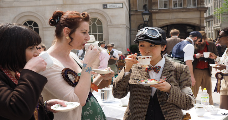 Cyclists sipping tea in the Tweed Run London