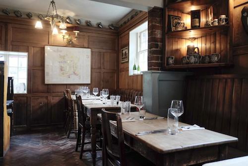 Restaurant tables inside the Wykeham Arms pub Winchester