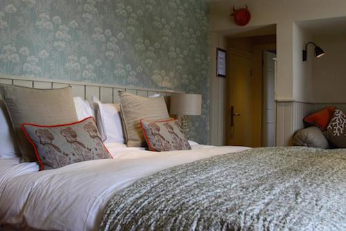 Luxury double room with pale blue furnishings at The Bull gastro pub