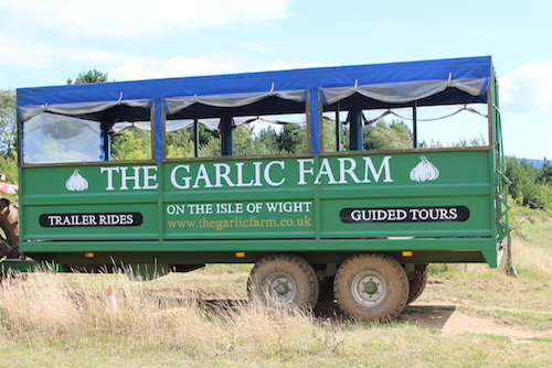 green Garlic Farm tour trailer in a field