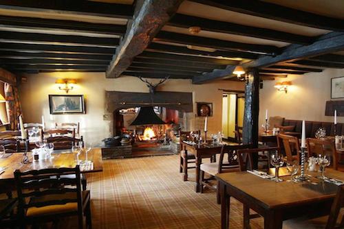 Inglenook fireplace and wooden beams inside Shibden Mill restaurant
