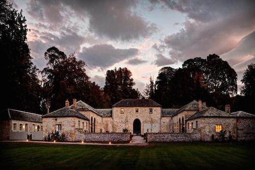 The Coach House photographed in the early evening light with pink clouds