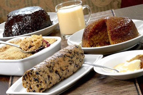 Selection of traditional British puddings including Spotted Dick