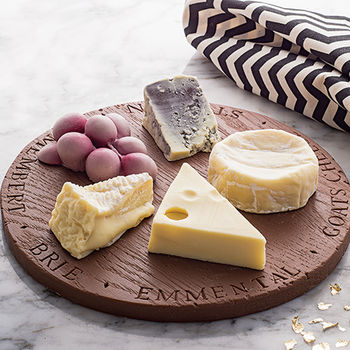 Chocolate cheese board with grapes and four cheeses