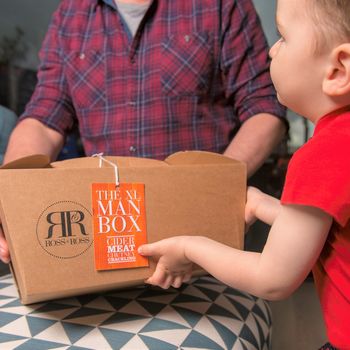 Man being given a cider hamper
